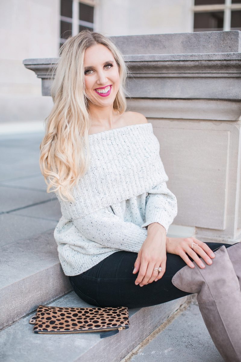 blush and camo, over the shoulder sweater, over the knee boots, black jeans, blonde hair, clare v, clare v clutch