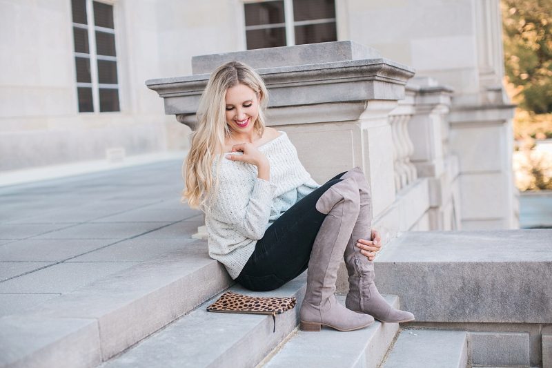 blush and camo, over the shoulder sweater, over the knee boots, black jeans, blonde hair, clare v, clare v clutch