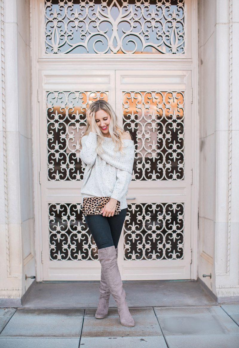 blush and camo, over the shoulder sweater, over the knee boots, black jeans, blonde hair, clare v, clare v clutch